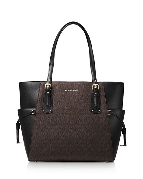 michael michael kors voyager east west leather tote|signature sinclair east west tote.